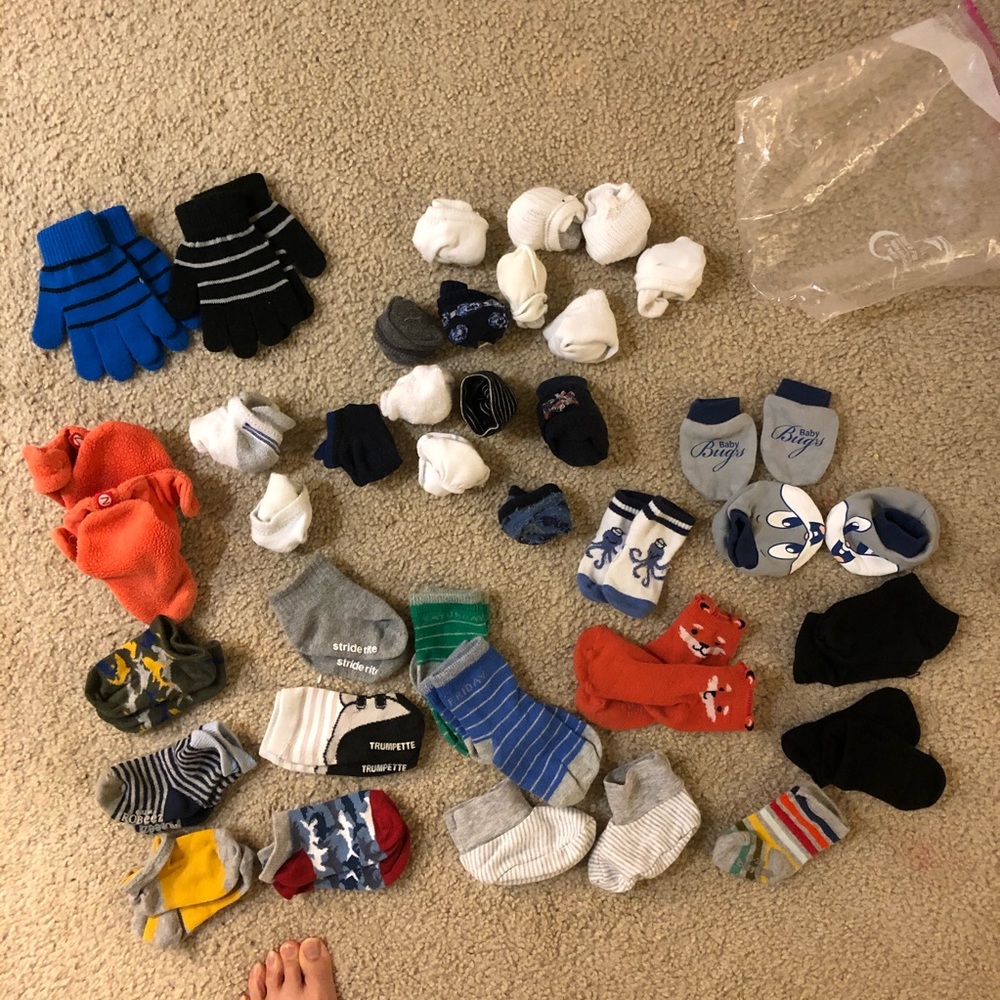35 pairs of socks, mittens, gloves, booties